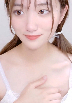 A fair-skinned woman with black hair who boldly shows off her breasts.