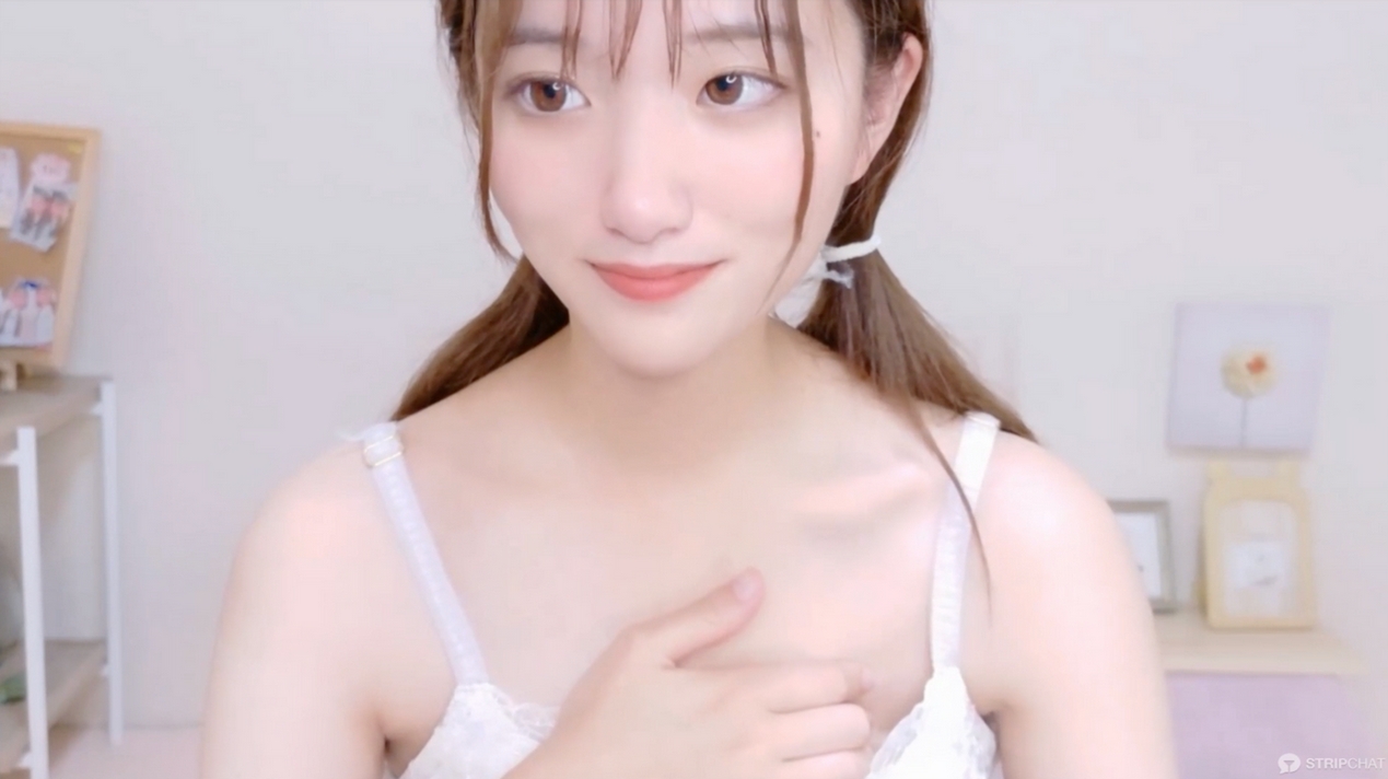 A fair-skinned woman with black hair who boldly shows off her breasts.